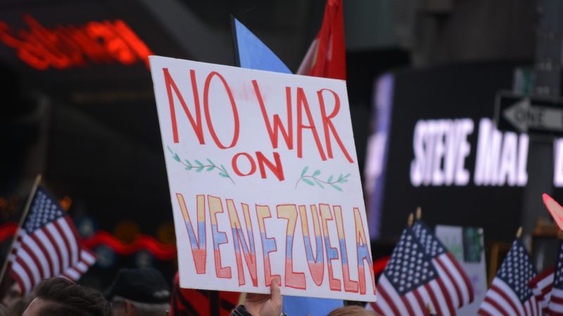 Placard reading "No war on Venezuela"