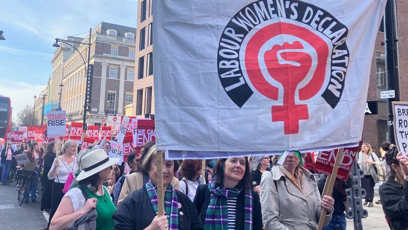 Women holding Labour Women's Declaration banner on a march.