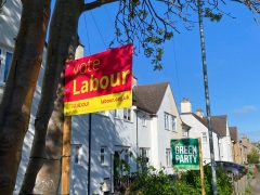 Labour and Green garden stakes next door to each other