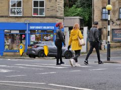 Young people crossing a road