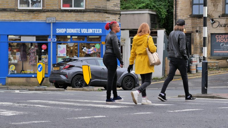 Young people crossing a road