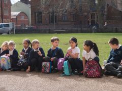 Young classroom students in front of Oxford University Museum of Natural History.