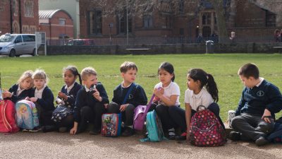Young classroom students in front of Oxford University Museum of Natural History.