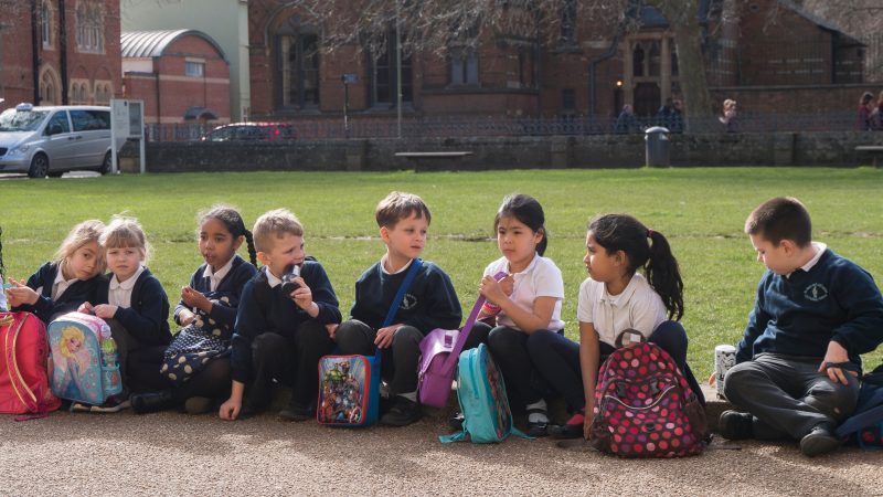 Young classroom students in front of Oxford University Museum of Natural History.