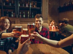 People enjoying beer in a pub.