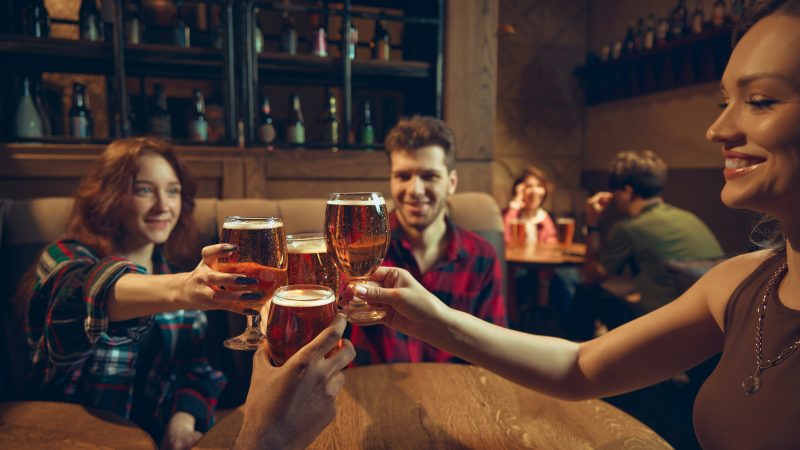 People enjoying beer in a pub.