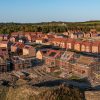 Aerial panoramic landscape view of a new build housing estate with houses under construction